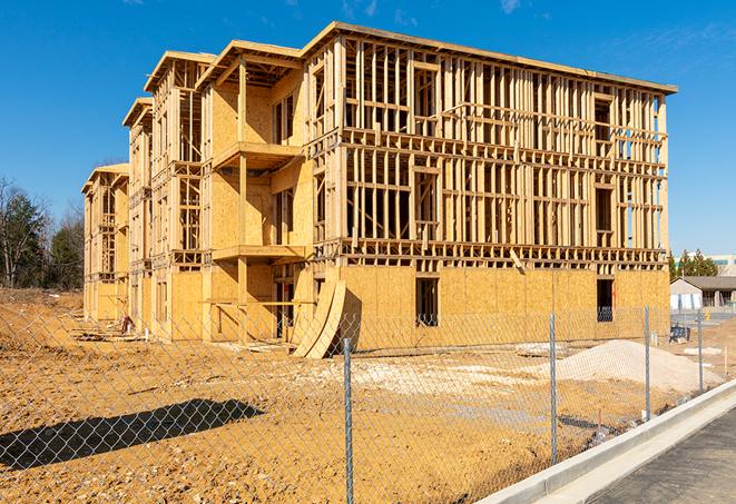 a panoramic view of temporary chain link fences on a job site, separating work zones in Foothill Ranch, CA